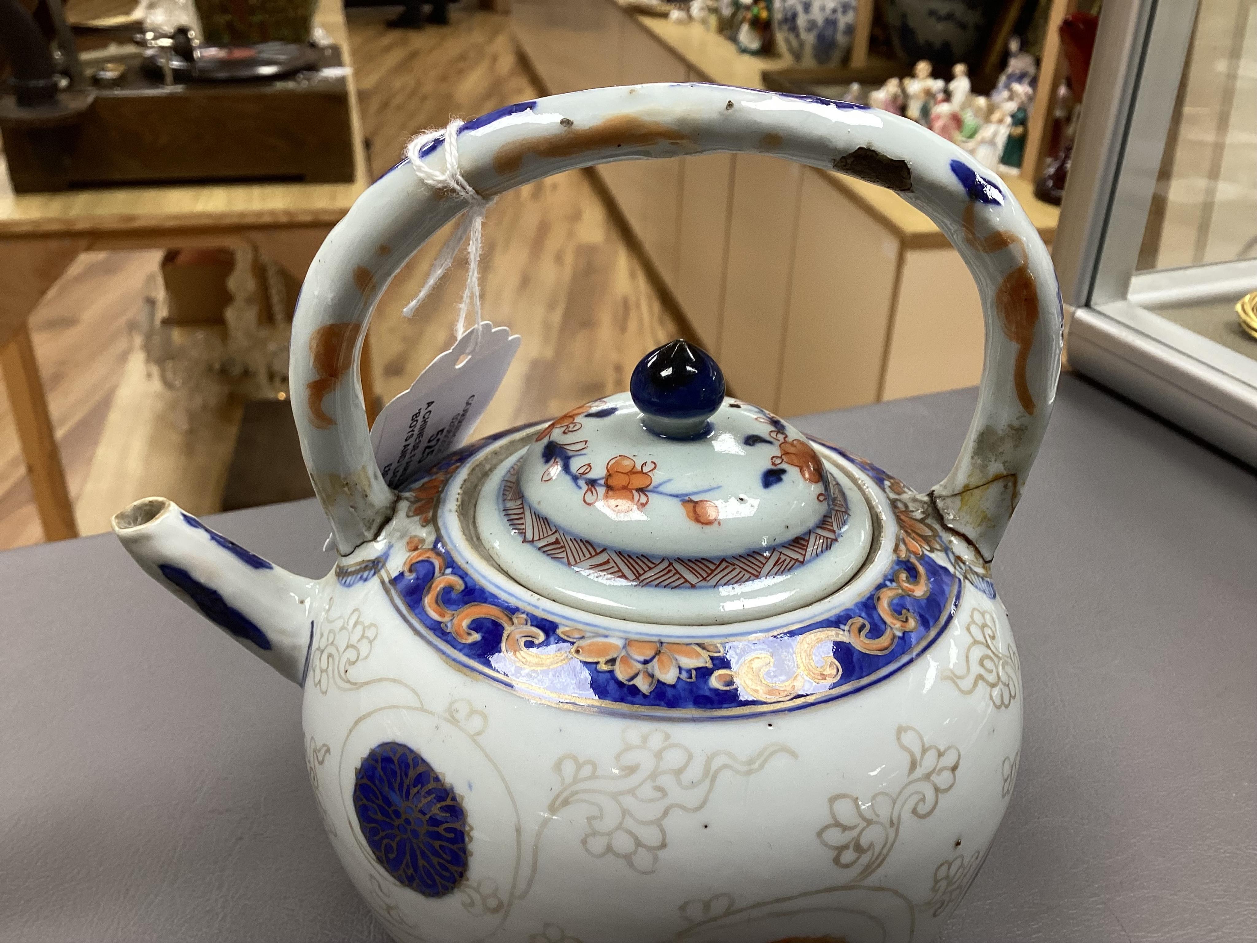 A Chinese famille rose ‘boys and ladies’ teapot, Qianlong period and a Japanese Arita sake pot or ewer, early 18th century, tallest 16cm high.